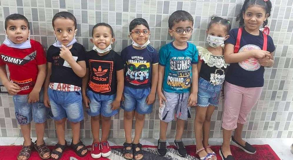 Smiling children with masks